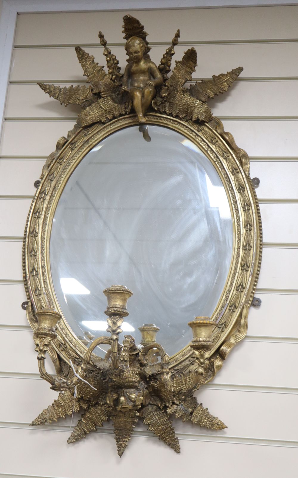 A Victorian gilt three branch girandole, height 88cm width 51cm